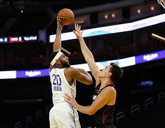 Golden State Warriors’ Marques Bolden (20) takes a shot against...