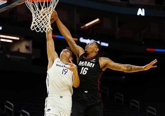 Miami Heat’s Keshad Johnson (16) fouls Golden State Warriors’ Leopold...