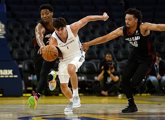 Golden State Warriors’ Taran Armstrong (1) fights for the ball...