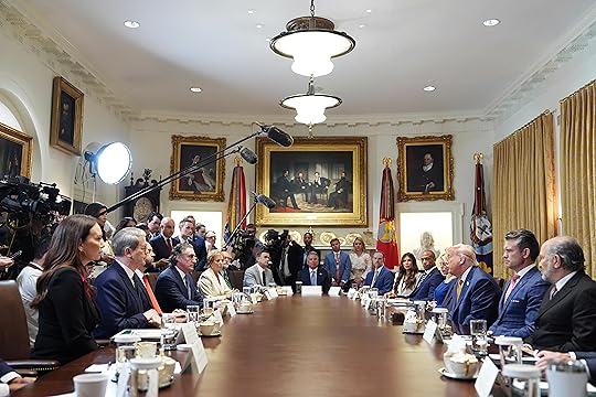 President Donald Trump, right seated, speaks during a cabinet meeting...