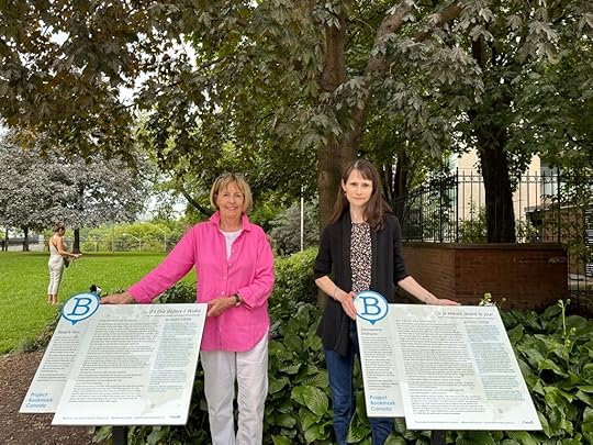 Hughena and Sarah with the Jean Little Bookmarks (two plaques, in English and French), located in a park