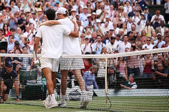 Italy's Jannik Sinner greets Spain's Carlos Alcaraz after winning their men's singles final tennis match on the fourteenth day of the 2025 Wimbledon...