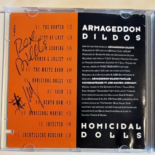 Back of the lyrics insert. In black ink it is signed 