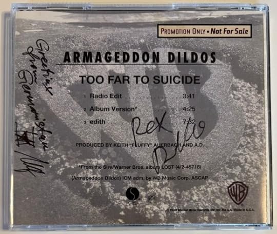 Back of the tray insert. It is grey scale and shows a picture of the WB logo in a garden. Says 