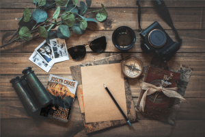 Packing for a travel adventure, including the Joslyn Chase book, Falling for The Lost Dutchman