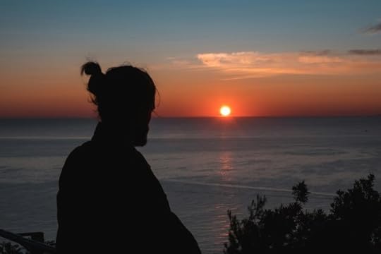 A person watching the sun rise. What’s on the other side of this mood?