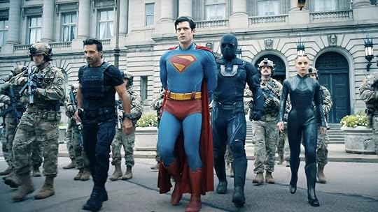 Ultraman, tje Engineer, and Rick Flag Sr accompany a handcuffed Superman along with soldiers