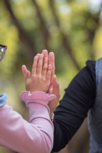 showing respect through touching hands