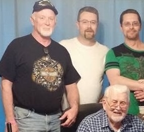 Four male family members comprising three generations
