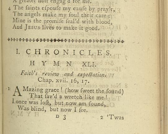 Lines of type in a book with yellow paper, including the first line of 