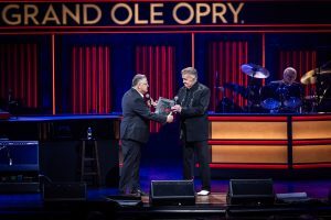 Dan Rogers presenting the Opry Gift for 100 anniversary of the Opry and the 64 anniversary of Bill Anderson in the Grand Ole Opry