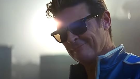 Karl Urban with sunglasses smiles as Johnny Cage in Mortal Kombat II