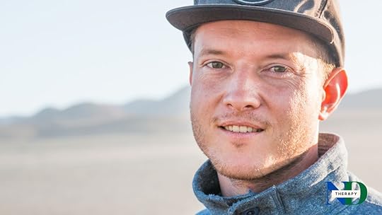 Man wearing a cap at the beach.