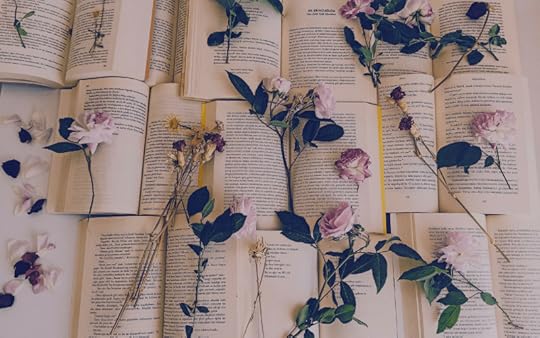 roses on top of open books