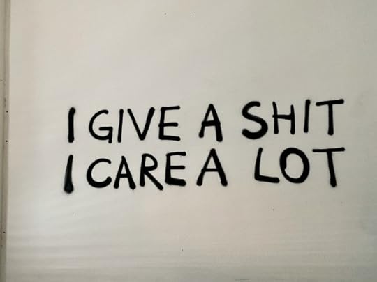 Words reading, “I give a shit. I care a lot.” Kindness, compassion, empathy, and caring empower. They are not in any way a sign of weakness.
