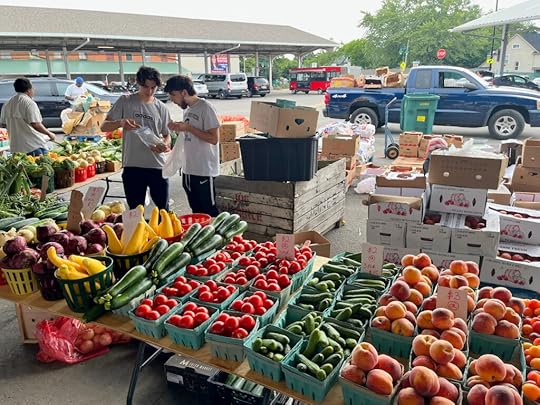 Picture of men choosing fruit at a farmer's market