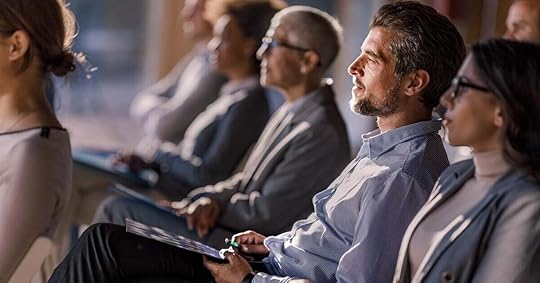 A cohort of sellers listen and take notes during upskilling training, as part of their company's everboarding program.