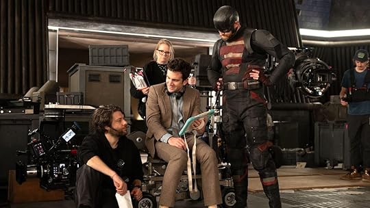 Director Jake Schreier sits while giving notes to cast and crew on Thunderbolts