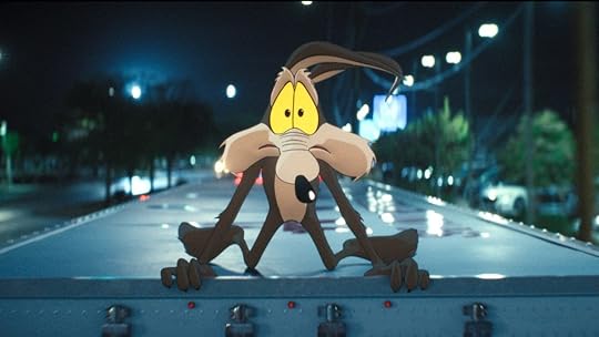 Wile E. Coyote holding on to the top of a truck in Coyote vs. Acme