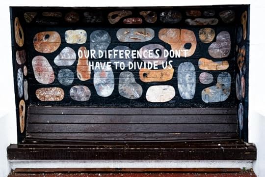 Writing on a painted wall: “Our differences don’t have to divide us.” There is no us vs them.