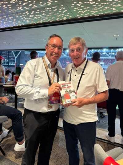 At Kai Tak Stadium, as Liverpool FC play AC Milan: stadium CEO John Sharkey presents Sir Kenny Dalglish with a copy of 