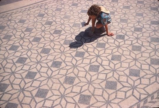 photo of Alison as a child on a Roman mosaic floor