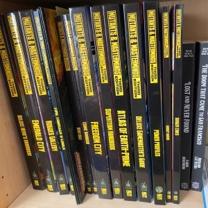 All my Mutants & Masterminds book spines on the shelf...