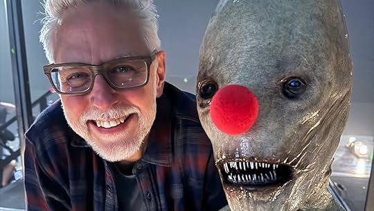 James Gunn with Mr. Handsome, an alien-like creature, wearing a red clown nose