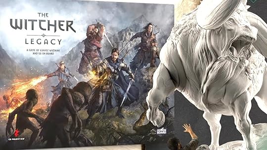 The box for The Witcher: Legacy board game next to a blown up versin of an unpainted Gorgon monster