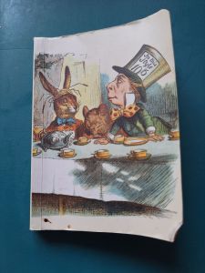 the cover of my Alice in Wonderland notebook, looking a bit dog-eared
