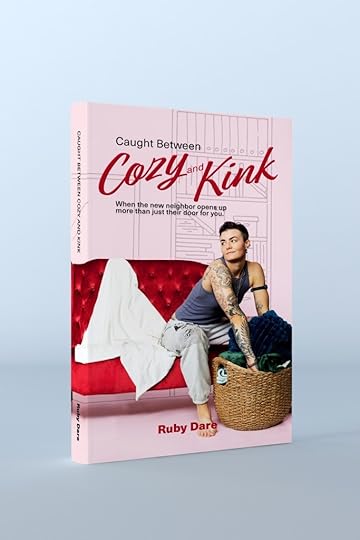 Cozy cover of Caught Between Cozy and Kink featuring King Captain, a white short-haired trans masc lesbian with a tattoo sleeve on a red couch, in a vest top and grey sweatpants, leaning into laundry basket of blankets with a straight back, bare foot. A towel is draped on the couch. The cover is pink and the tagline reads: When the new neighbor opens up more than just their door for you.