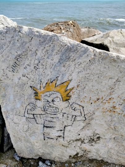 Thangasserry Breakwater Tourism Park. Faded graffiti on a rock.