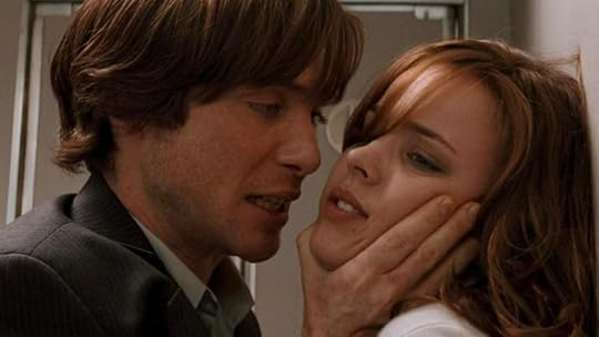 Jackson grasping Lisa's chin and holding her against a wall in confrontation.