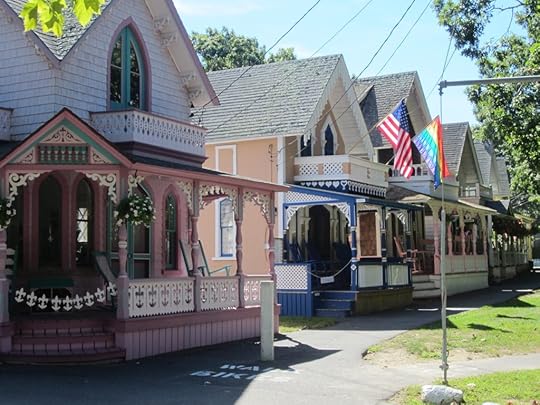A row of brightly covered cottages with ornate trim in Oak Bluffs on Martha's Vineyard