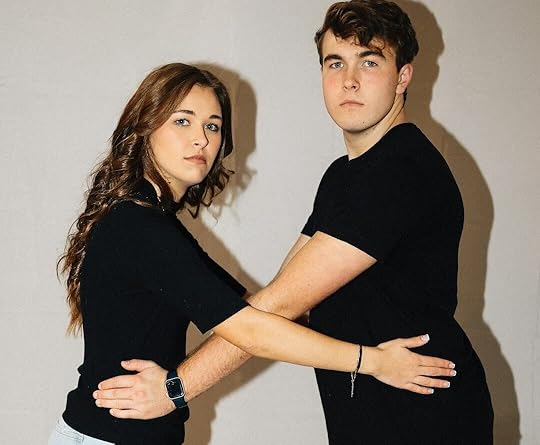 A woman and a man are posing together.