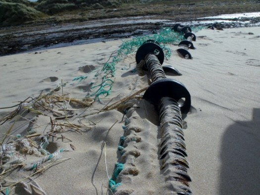 washed up fishing net at the waters of philorth