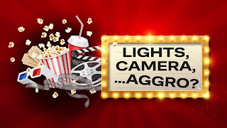 The title 'Lights, Camera... Aggro?' is framed by cinema lights, as popcorn, drinks, movie reels, 3D glasses, and movie tickets spill out from the top. All this is presented on a red background.