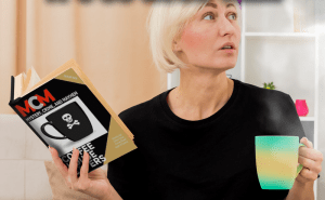 Woman drinking coffee while reading the Coffee House Capers edition of Mystery, Crime, and Mayhem magazine