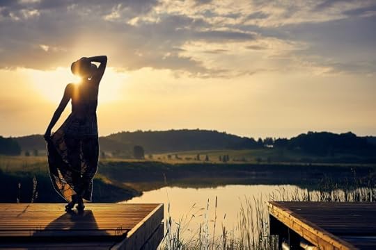 A woman on a dock in a hat shadowed by the sun. What do you/can you control in life?