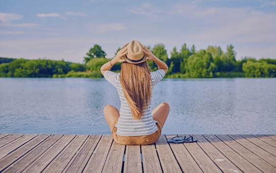 woman sitting on a dock