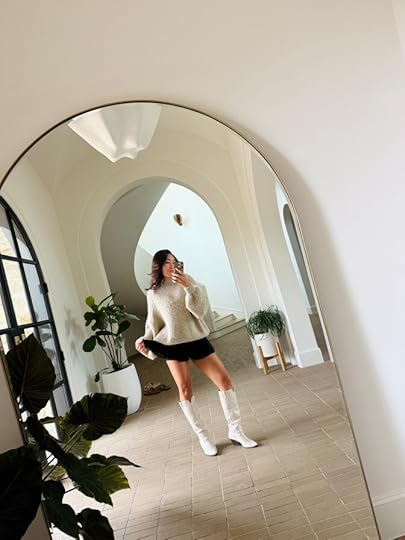 cassey ho wearing popflex butterfly short in black with cream sweater and boots fall outfit