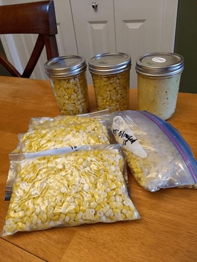 Corn ready for the freezer, in both freezer safe jars and freezer bags.
