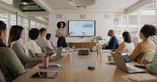 Sales trainer presents recent performance statistics to managers and other leaders