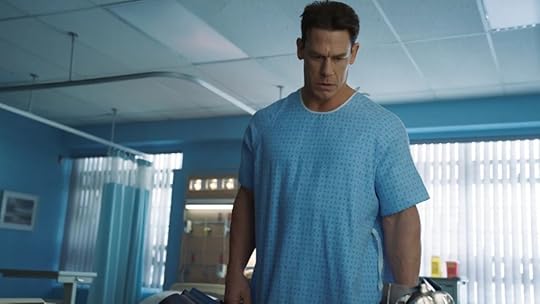 John Cena as Peacemaker wears a medical gown in Episode 1 of the first season