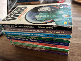 Stack of early Doctor Who paperbacks published by Target, Doctor Who and the Cybermen on the top