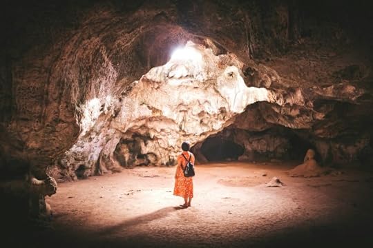 A woman in a dress in a cave. The unknown is only scary if you choose to be afraid of it. 