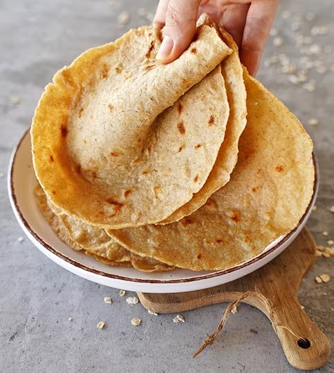 hand holding oatmeal tortillas