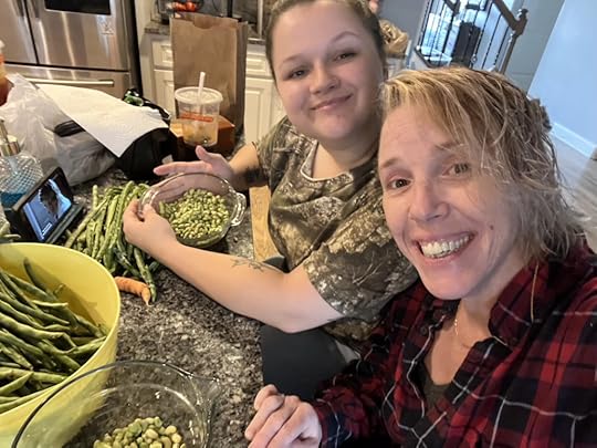 Elicia shelling peas at home