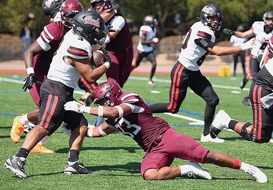 Monterey Peninsula College linebacker Damien Neveaux brings down Foothill running...