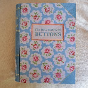 a tin by Cath Kidston labelled The Book of Buttons